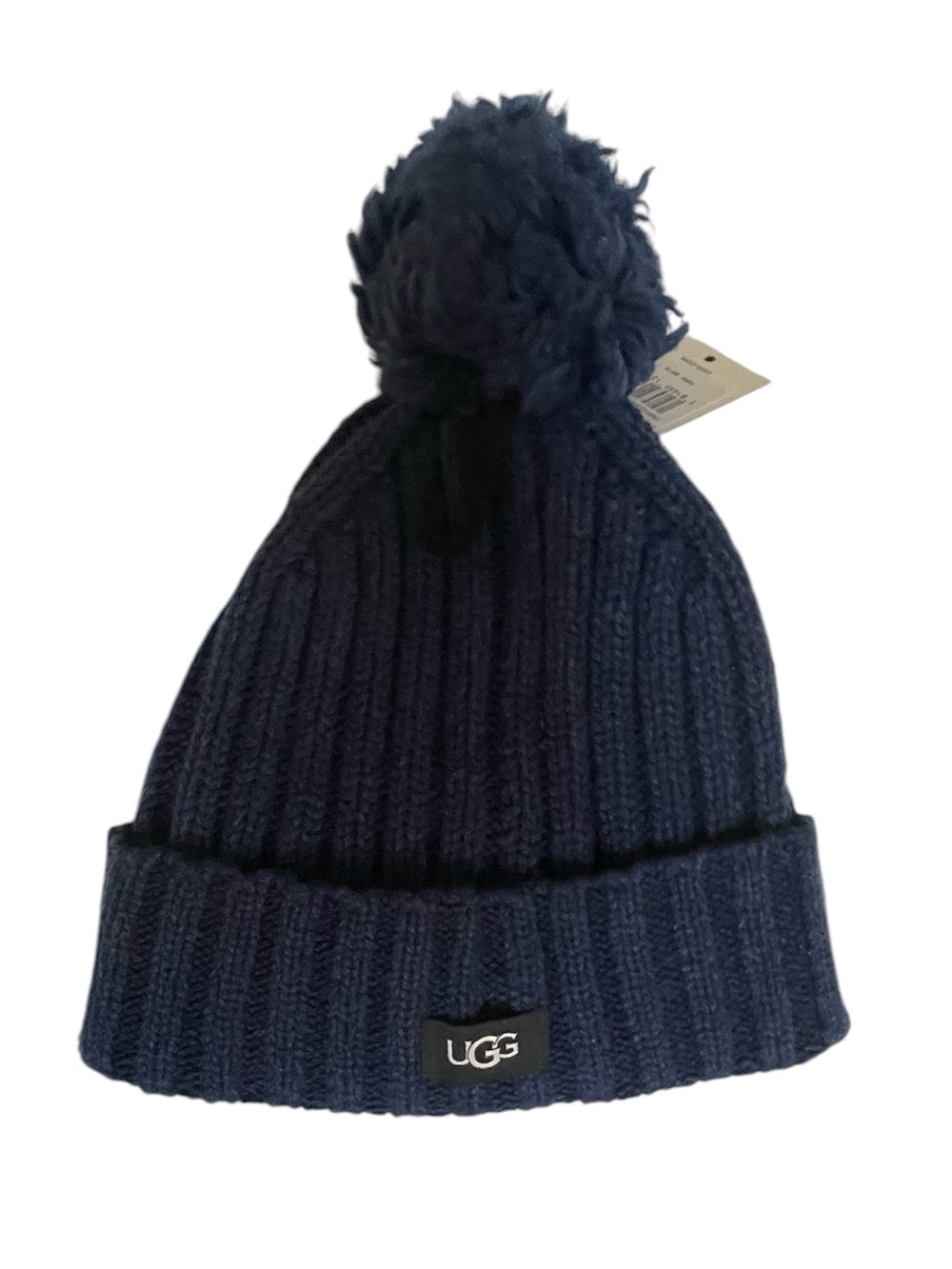 UGG knit pompom beanie NWT in Navy features a classic ribbed texture